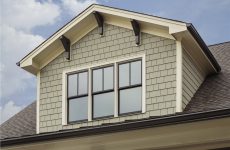 Architectural details of a house adorned with Fiber Cement Siding for a timeless and elegant look.