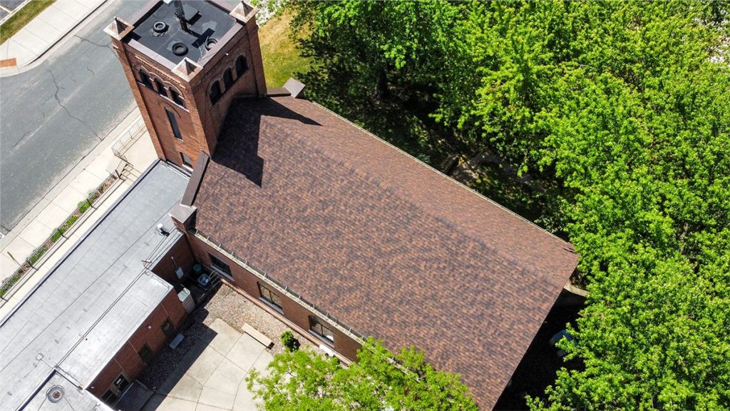 Aerial view of a church roof replacement completed by our team.