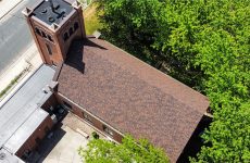Aerial view of a church roof replacement completed by our team.