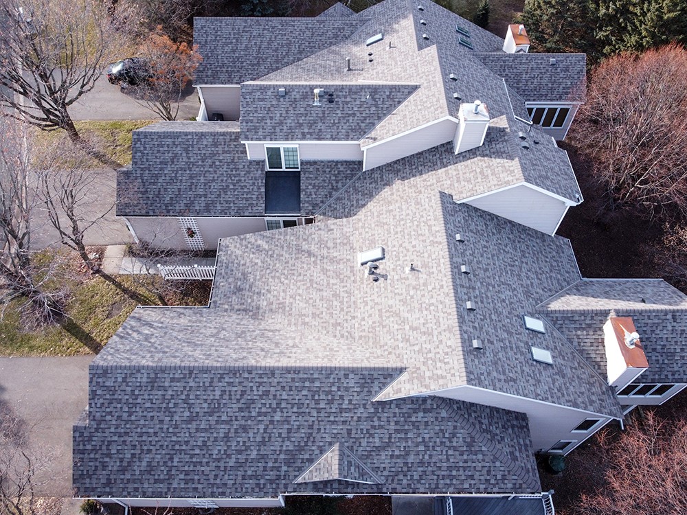 Completed townhome roof replacement from an on-roof perspective.
