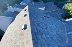 Roofing consultant's perspective from the roof, capturing the excellence of a completed roof replacement.