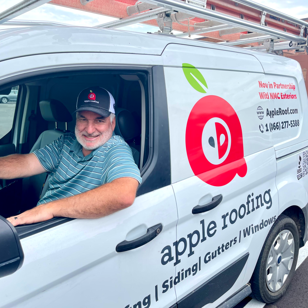 Apple Roofing Consultant Brian in his vehicle, prepared for the next roofing project